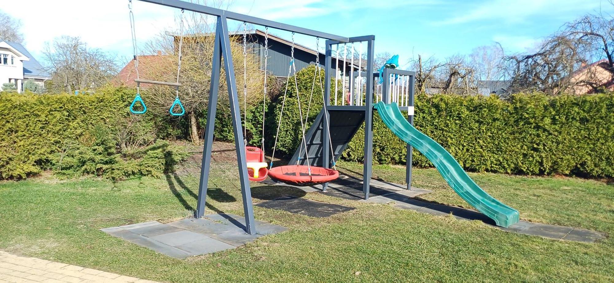 Апартаменты Family Garden With Free Private Parking & Playground Рига